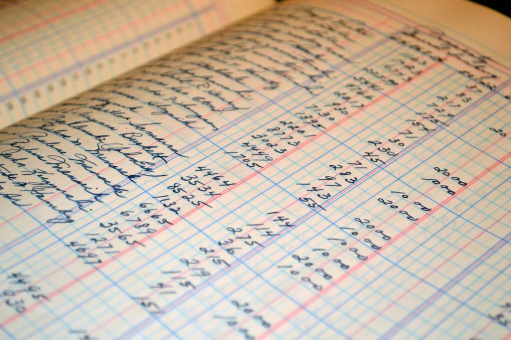 Close-up of a vintage handwritten ledger detailing financial records and accounts.